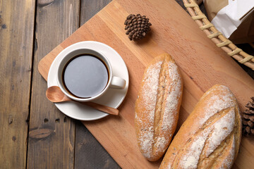 Bread and coffee on butcher.