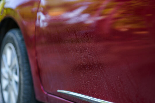 Close-up Dust On The Surface Of Red Auto Window Motor Car Of Shiny Convertible Luxury Outside Background,transportation Trip Concept