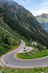 Fototapeta na wymiar Cars on a serpentine of mountain tourist pass, Austria