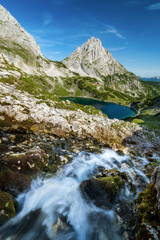 Hiking in european alps at lake drachensee near coburger hütte hut in ehrwald beautiful mountains and scenery