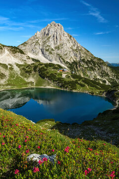 Hiking in european alps at lake drachensee near coburger h&uuml;tte hut in ehrwald beautiful mountains and scenery