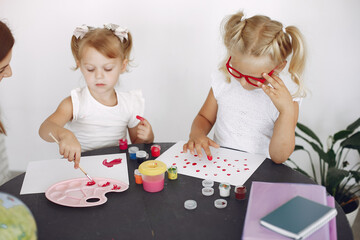 Tutor with pupils. Little girls studying. Private lesson.