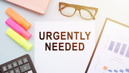 Writing a text is urgently required. Business concept for compelling or requiring immediate action or attention. Calculator, financial graph, markers and glasses on the office desk