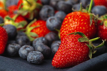 Close up photo of blueberries and strawberries