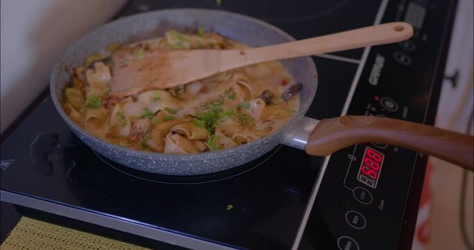 Woman cooks Pasta