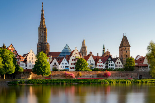 Ulmer minster in the morning at sunrise with reflection in river danube. Ulm 2020 spring