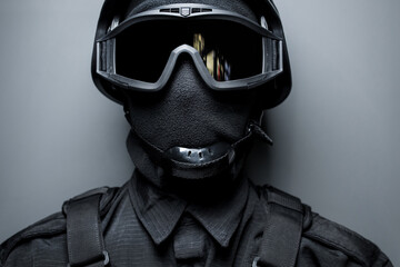 SWAT in black uniform, face mask and bulletproof vest. Russian special forces. Tactical helmet vest...