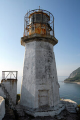 Fototapeta na wymiar Rudny lighthouse on Briner cape. Outskirts of Rudnaya Pristan town, Primorsky Krai (Primorye), Far East, Russia..