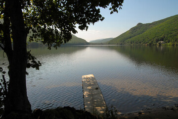 Wooden pier on the lake. Vaskovskoye lake, Rudnaya Pristan town, Primorsky Krai (Primorye), Far East, Russia.