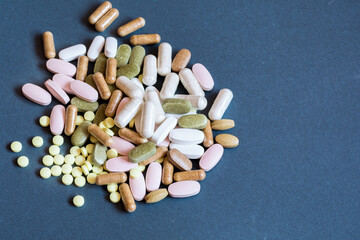 A lot of different drugs, pills, on a dark background. view from above - 365012614