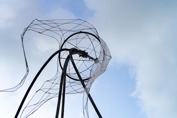 Figures of jellyfish on a background of a sunset sky.