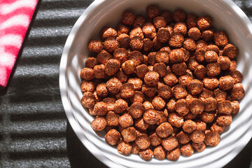 Chocolate balls cereal breakfast light through top view blinds
