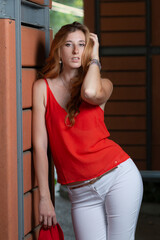 enterprising young woman in red clothes leaving work