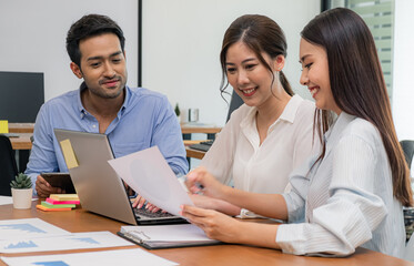 Young business group explaining new business ideas to peers. Business people discussing in meeting...