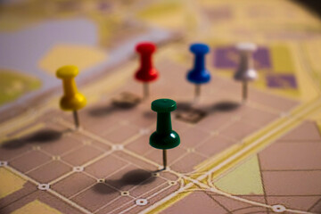 Closeup shot of colorful pins in street map
