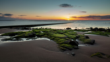 Sunrise at Cresswell Beach on the coast of Northumberland, England, UK.