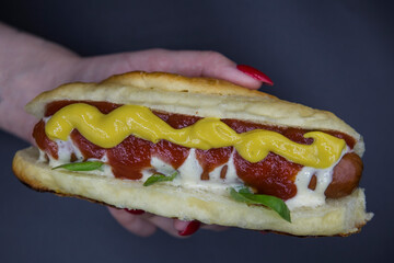 
Photos of a bun with sausage and ketchup