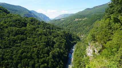 River in the mountains, landscape, top view. Wild nature. Mountains, green forest. Tourist route. Montenegro.