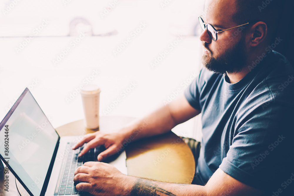 Poster cropped image of handsome skilled it professional chatting with customer about implementing new feat