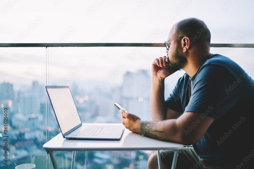 Poster contemplative bearded creative businessman thinking about new ideas for implementation in startup pr