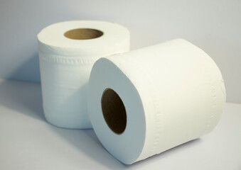 Closeup shot of 2 toilet rolls on white background