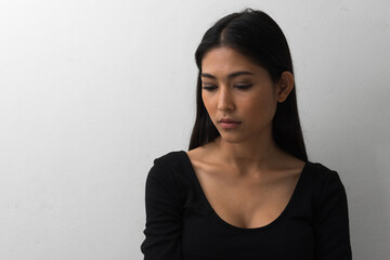 Portrait of young beautiful Asian businesswoman against white background