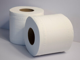 Closeup shot of 2 toilet rolls on white background