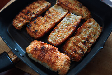 The crispy seared bread in the skillet