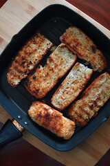 The crispy seared bread in the skillet
