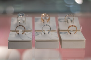 Gold wedding rings. Set of rings on the showcase.