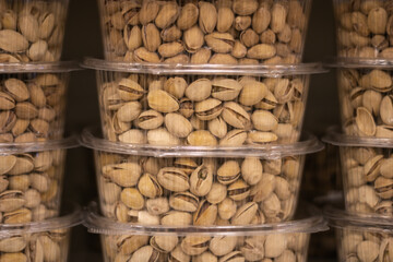 Pistachios in transparent plastic packaging. Photo on the theme of nuts.