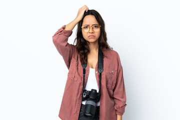 Young photographer woman over isolated white background with an expression of frustration and not...