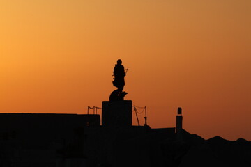 Statue sunset