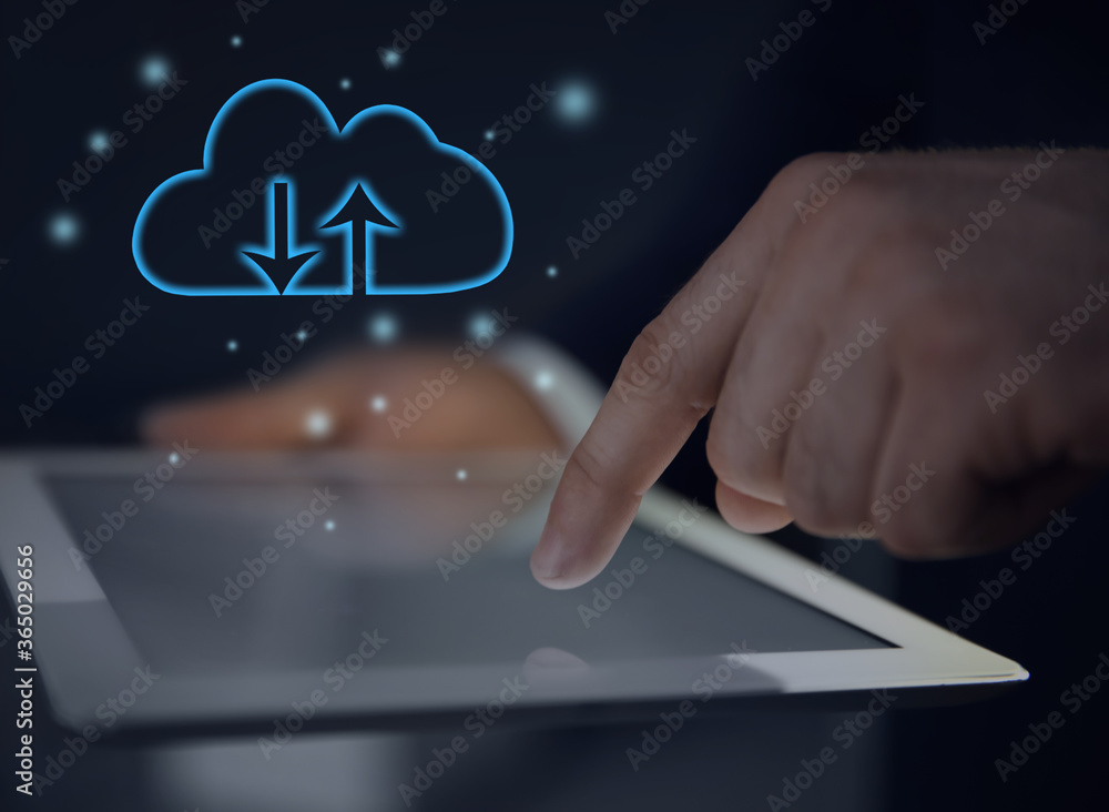 Poster cloud computing and storage concept. man using tablet on dark background, closeup