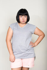 Portrait of young beautiful overweight Asian woman