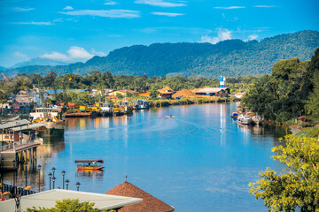 Lawas, Sarawak, Malaysia cityscape with river and mountain background - 365030679