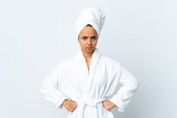 Young woman in bathrobe over isolated white background angry