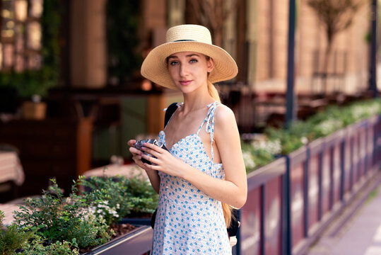 Young Woamn Walking In The City While On Sightseeing Tour