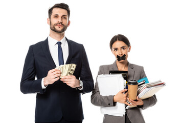 handsome businessman holding dollars near businesswoman with duct tape on mouth isolated on white,...
