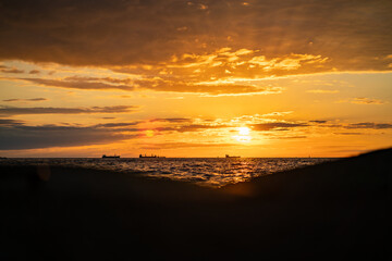 Fototapeta na wymiar Beautiful golden summer sunset at the seaside