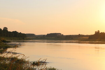 Sunny evening on the river in the countryside