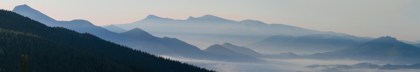 Bizkaia mountains at sunrise with Gorbea in the background and fog in the valleys
