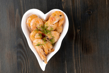 boiled tails of king shrimps on a white dish