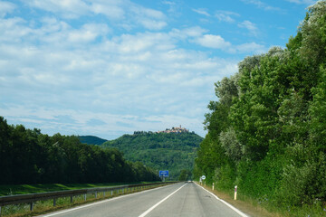 The medieval city of Motovun and the scenic asphalt road in Istria, Croatia