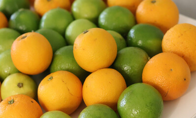 Beautiful lemons and oranges arranged on a table. A fruit rich in vitamin c.