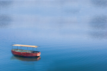 floating boat on lake water beautiful nature background.