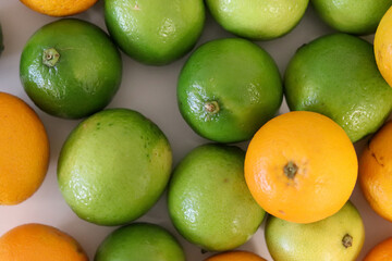 Beautiful lemons and oranges arranged on a table. A fruit rich in vitamin c.