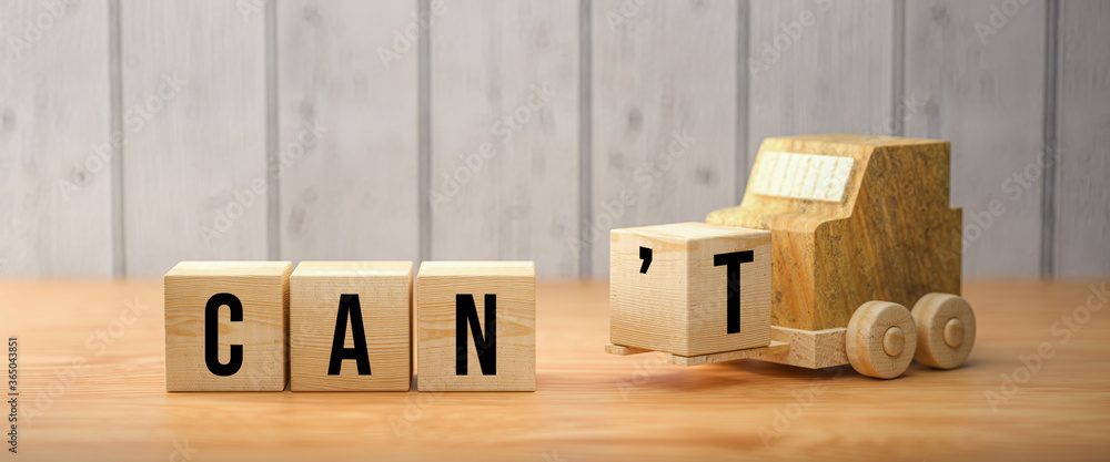 Wall mural wooden forklift is transporting off a cube to alter a message from can't to can