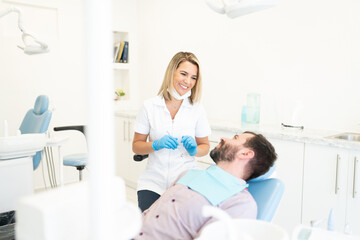 Fototapeta premium Man Visiting Dentist At Clinic
