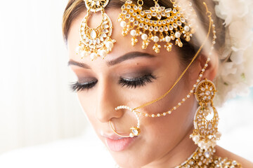 Beautiful Sikh bride wearing traditional wedding attire and jewelry